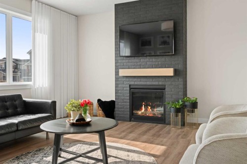 229 Precedence View, Cochrane, AB - Indoor Photo Showing Living Room With Fireplace
