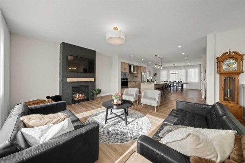 229 Precedence View, Cochrane, AB - Indoor Photo Showing Living Room With Fireplace