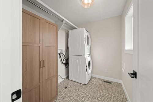 229 Precedence View, Cochrane, AB - Indoor Photo Showing Laundry Room
