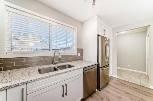 393 Legacy Boulevard Se, Calgary, AB - Indoor Photo Showing Kitchen With Stainless Steel Kitchen With Double Sink