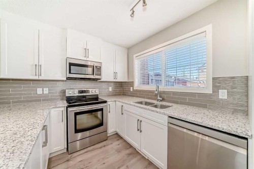 393 Legacy Boulevard Se, Calgary, AB - Indoor Photo Showing Kitchen With Stainless Steel Kitchen With Double Sink With Upgraded Kitchen