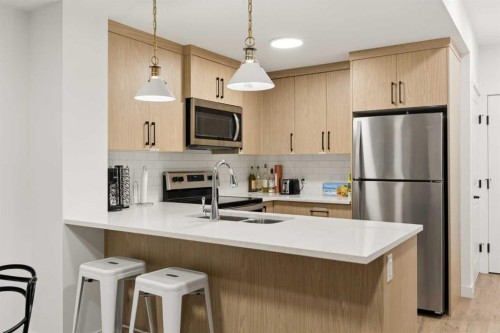 345 Calhoun Common Ne, Calgary, AB - Indoor Photo Showing Kitchen With Stainless Steel Kitchen With Double Sink