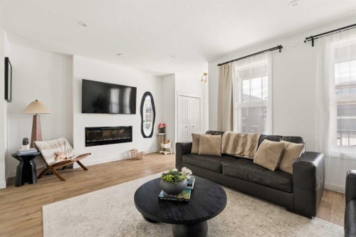 345 Calhoun Common Ne, Calgary, AB - Indoor Photo Showing Living Room With Fireplace