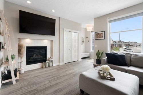 170 Seton Grove Se, Calgary, AB - Indoor Photo Showing Living Room With Fireplace