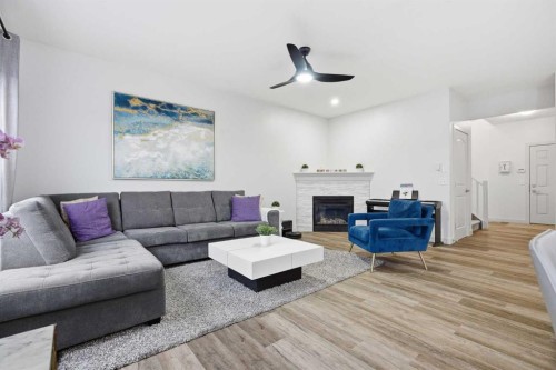 107 Everwoods Park Sw, Calgary, AB - Indoor Photo Showing Living Room With Fireplace