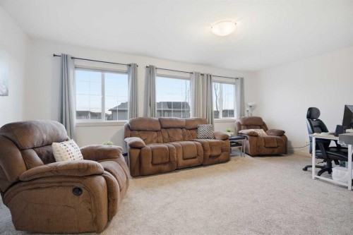 107 Everwoods Park Sw, Calgary, AB - Indoor Photo Showing Living Room