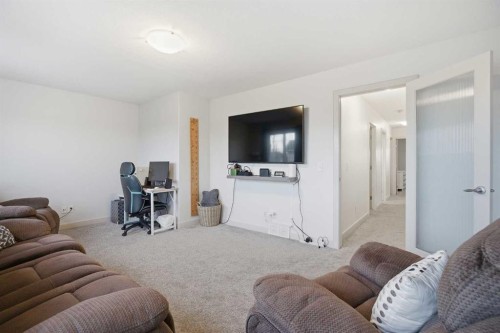 107 Everwoods Park Sw, Calgary, AB - Indoor Photo Showing Living Room