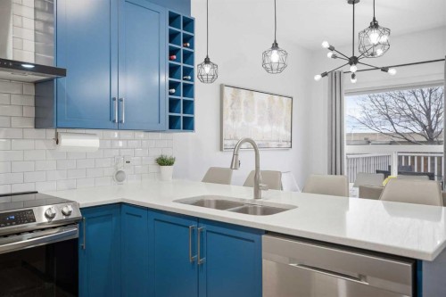 107 Everwoods Park Sw, Calgary, AB - Indoor Photo Showing Kitchen With Double Sink With Upgraded Kitchen