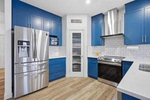 107 Everwoods Park Sw, Calgary, AB - Indoor Photo Showing Kitchen With Double Sink With Upgraded Kitchen