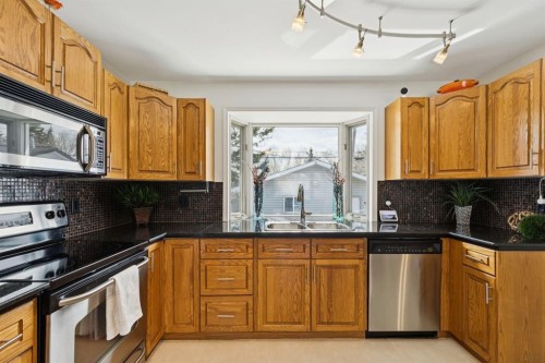 3215 Boulton Road Nw, Calgary, AB - Indoor Photo Showing Kitchen With Stainless Steel Kitchen With Double Sink