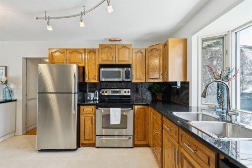 3215 Boulton Road Nw, Calgary, AB - Indoor Photo Showing Kitchen With Stainless Steel Kitchen With Double Sink