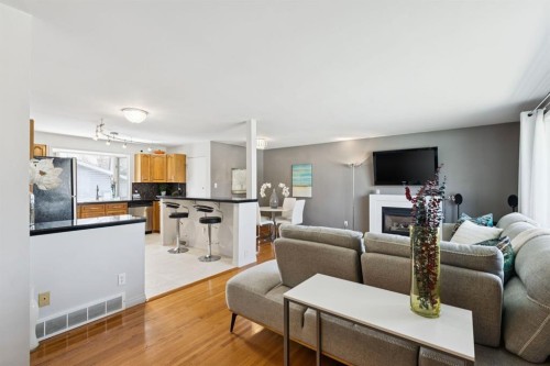 3215 Boulton Road Nw, Calgary, AB - Indoor Photo Showing Living Room With Fireplace