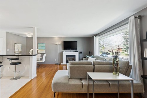 3215 Boulton Road Nw, Calgary, AB - Indoor Photo Showing Living Room With Fireplace
