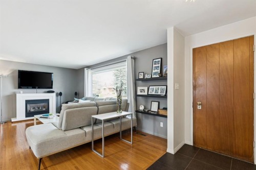 3215 Boulton Road Nw, Calgary, AB - Indoor Photo Showing Living Room With Fireplace