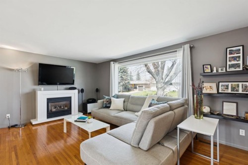 3215 Boulton Road Nw, Calgary, AB - Indoor Photo Showing Living Room With Fireplace