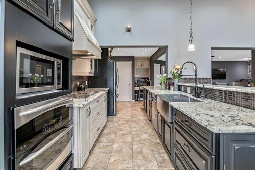 1105 Turner Gate Sw, Diamond Valley, AB - Indoor Photo Showing Kitchen With Double Sink With Upgraded Kitchen