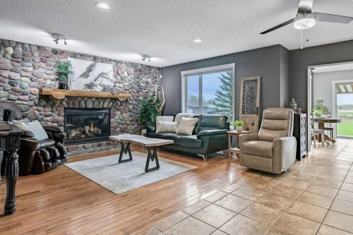 1105 Turner Gate Sw, Diamond Valley, AB - Indoor Photo Showing Living Room With Fireplace