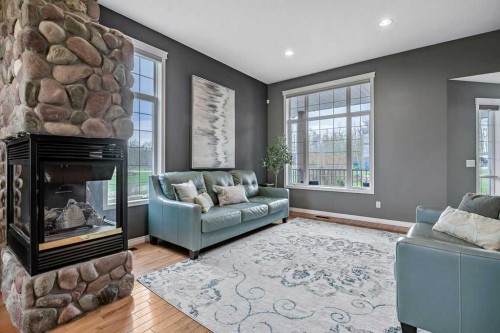1105 Turner Gate Sw, Diamond Valley, AB - Indoor Photo Showing Living Room With Fireplace