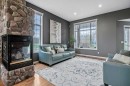 1105 Turner Gate Sw, Diamond Valley, AB  - Indoor Photo Showing Living Room With Fireplace 