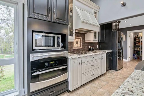1105 Turner Gate Sw, Diamond Valley, AB - Indoor Photo Showing Kitchen With Upgraded Kitchen