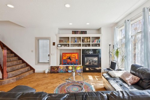 2405 Bowness Road Nw, Calgary, AB - Indoor Photo Showing Living Room With Fireplace