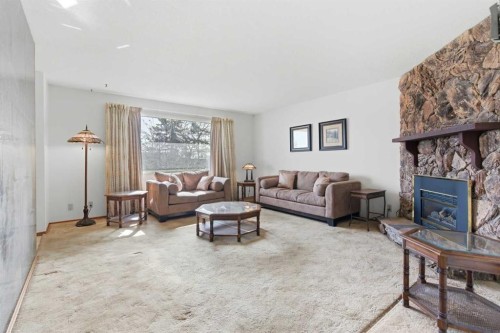 6215 Thorncliffe Drive Nw, Calgary, AB - Indoor Photo Showing Living Room With Fireplace