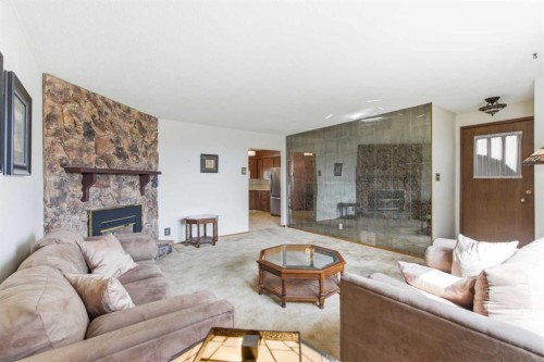 6215 Thorncliffe Drive Nw, Calgary, AB - Indoor Photo Showing Living Room With Fireplace