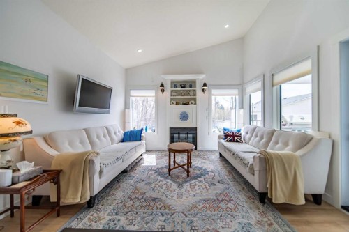 9 Scripps Landing Nw, Calgary, AB - Indoor Photo Showing Living Room With Fireplace