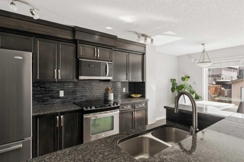 177 Walden Manor Se, Calgary, AB - Indoor Photo Showing Kitchen With Double Sink With Upgraded Kitchen