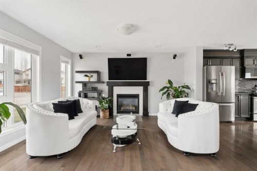 177 Walden Manor Se, Calgary, AB - Indoor Photo Showing Living Room With Fireplace