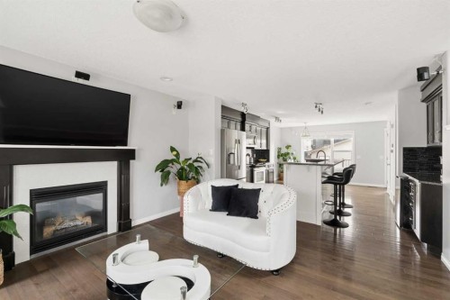 177 Walden Manor Se, Calgary, AB - Indoor Photo Showing Living Room With Fireplace