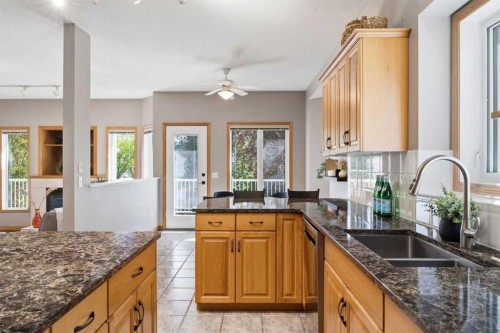 545 Rocky Ridge Bay Nw, Calgary, AB - Indoor Photo Showing Kitchen With Double Sink