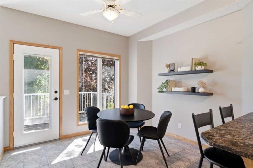 545 Rocky Ridge Bay Nw, Calgary, AB - Indoor Photo Showing Dining Room
