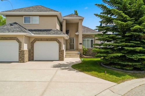 545 Rocky Ridge Bay Nw, Calgary, AB - Outdoor With Facade