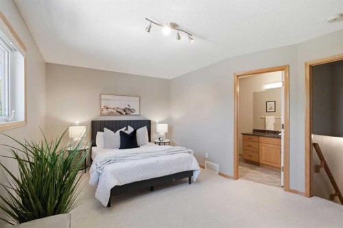 545 Rocky Ridge Bay Nw, Calgary, AB - Indoor Photo Showing Bedroom