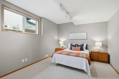 545 Rocky Ridge Bay Nw, Calgary, AB - Indoor Photo Showing Bedroom