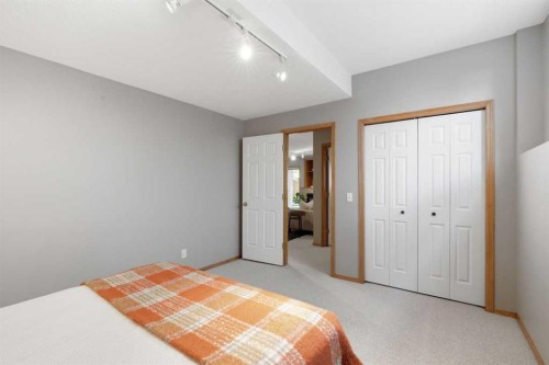 545 Rocky Ridge Bay Nw, Calgary, AB - Indoor Photo Showing Bedroom
