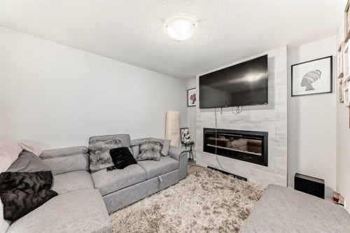 115 Cityscape Boulevard Ne, Calgary, AB - Indoor Photo Showing Living Room With Fireplace