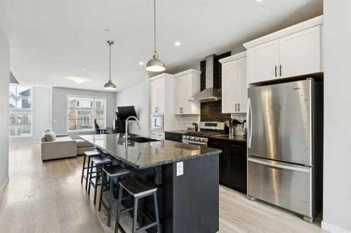 29 Howse Row Ne, Calgary, AB - Indoor Photo Showing Kitchen With Upgraded Kitchen