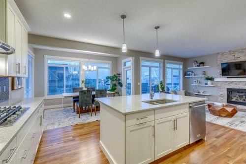490 Mahogany Manor Se, Calgary, AB - Indoor Photo Showing Kitchen With Fireplace With Double Sink