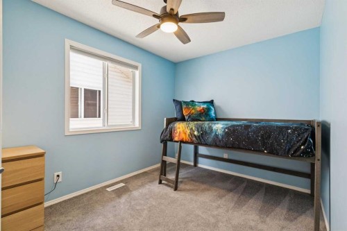108 Somerside Crescent Sw, Calgary, AB - Indoor Photo Showing Bedroom