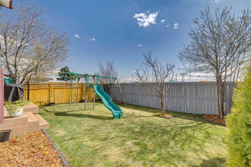 108 Somerside Crescent Sw, Calgary, AB - Outdoor With Backyard