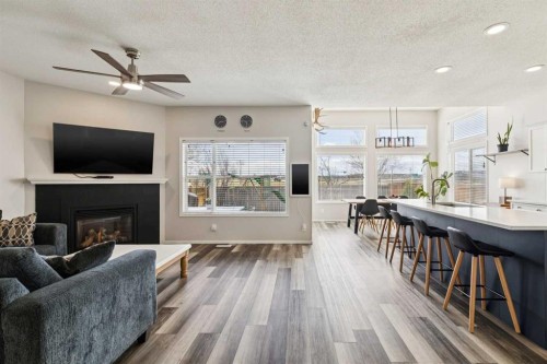 108 Somerside Crescent Sw, Calgary, AB - Indoor Photo Showing Living Room With Fireplace