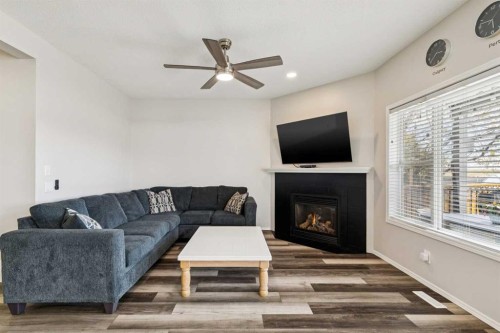 108 Somerside Crescent Sw, Calgary, AB - Indoor Photo Showing Living Room With Fireplace