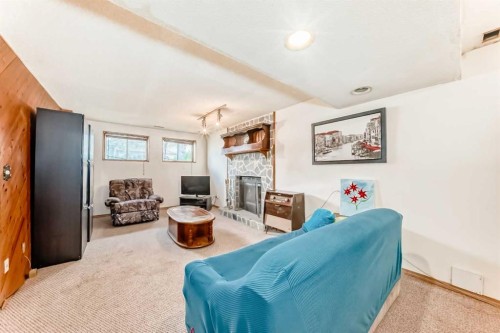 43 Mckenna Way Se, Calgary, AB - Indoor With Fireplace