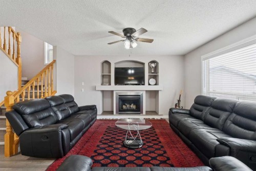 35 Saddletree Drive Ne, Calgary, AB - Indoor Photo Showing Living Room With Fireplace