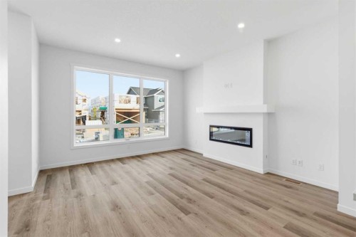 199 Annette Landing, Calgary, AB - Indoor Photo Showing Living Room With Fireplace