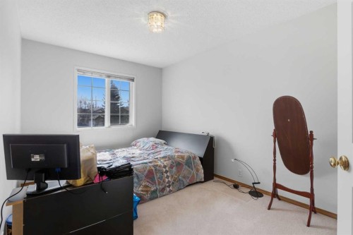 28 Sunlake Circle Se, Calgary, AB - Indoor Photo Showing Bedroom