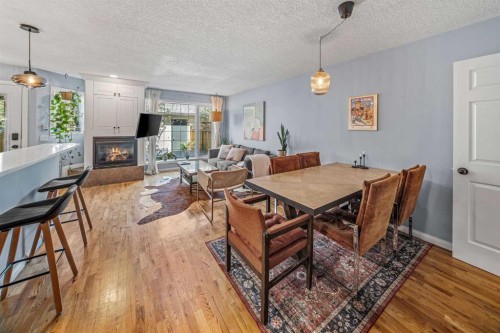2-306 14 Avenue Ne, Calgary, AB - Indoor Photo Showing Other Room With Fireplace