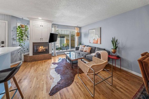 2-306 14 Avenue Ne, Calgary, AB - Indoor Photo Showing Living Room With Fireplace